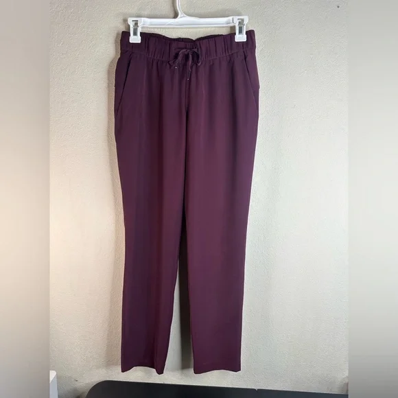 Lululemon On The Fly Pant Woven 27" size 4 maroon - Picture 2 of 6